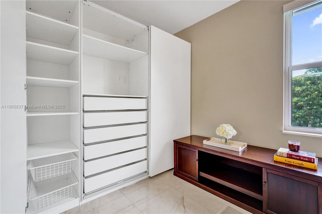 Bedroom 2 showing custom closet system