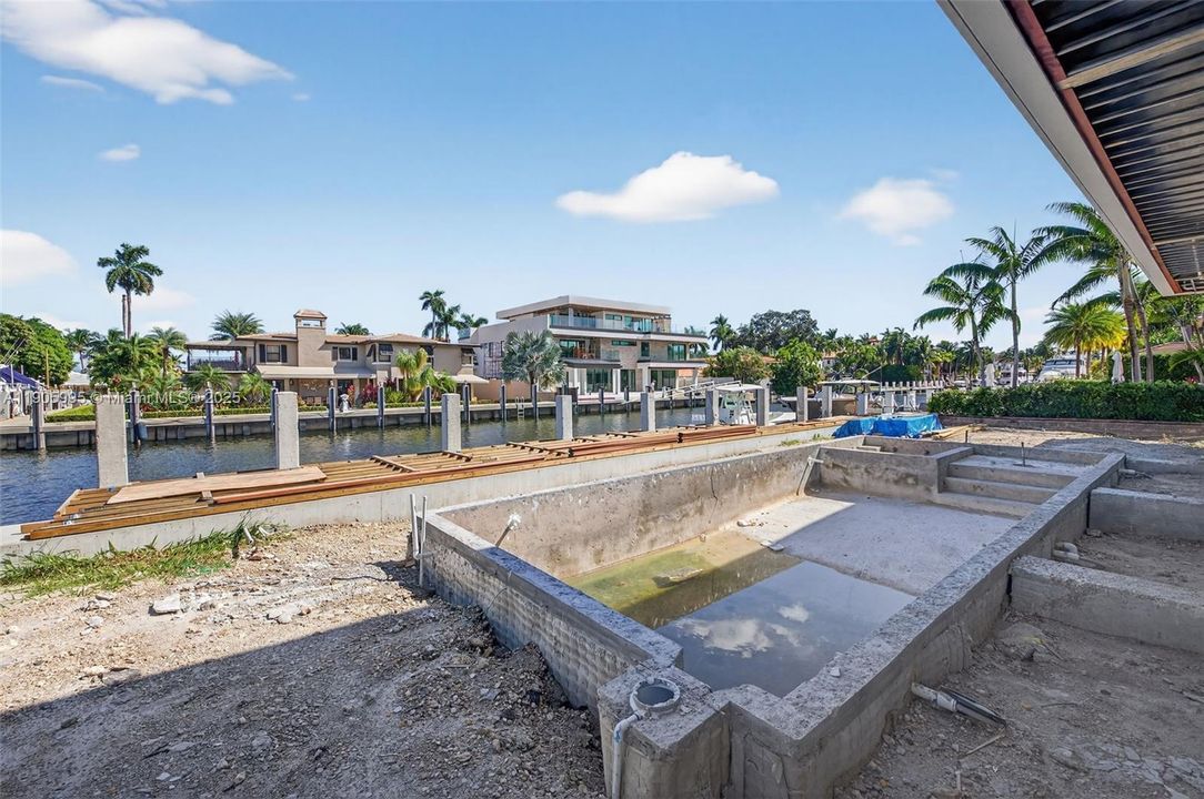 Actual photo as of Oct 31, 2025. Imagine the pool deck in limestone w/ lush landscaping