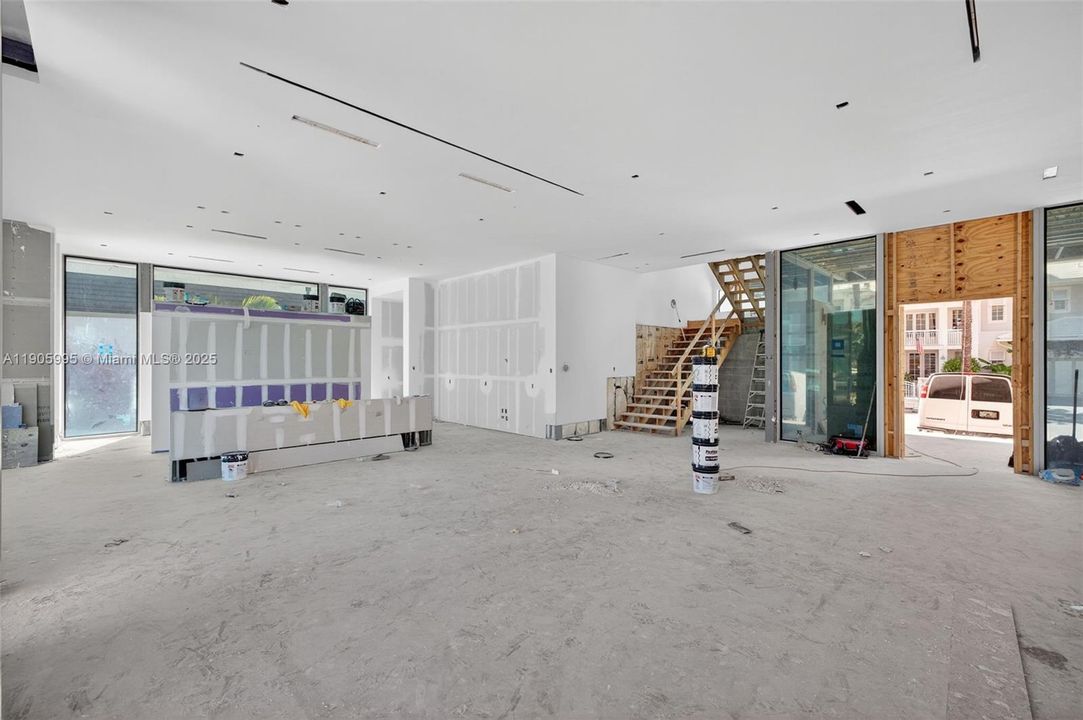 Actual photo as of Oct 31, 2025. View from Family Room toward kitchen and foyer. Stairs will be floating stairs.