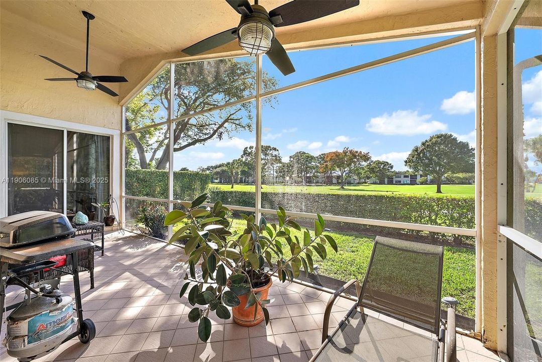 Walk out from Primary Bedroom to L-shaped screened in porch with privacy and golf views.