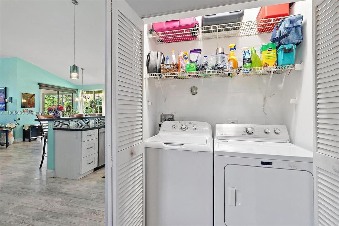 Washer/Dryer with storage in closet.