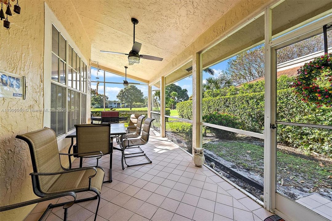 Walk out from Dining/Living room to L-shaped screened in porch with privacy and golf views.