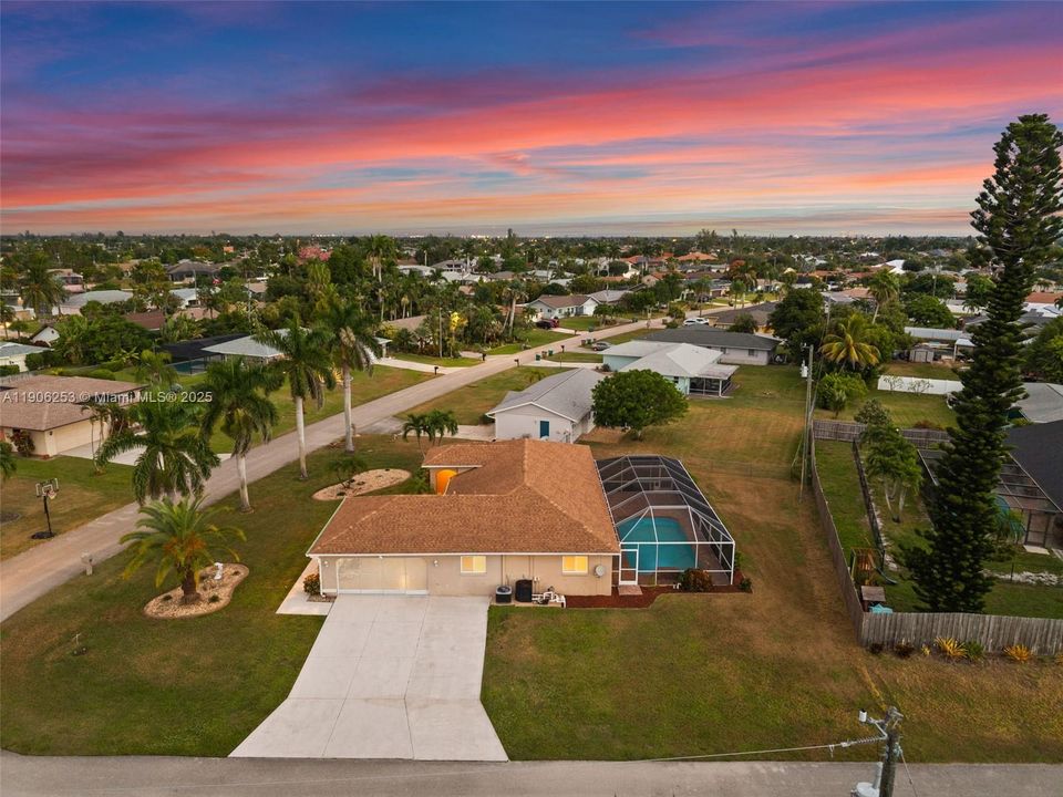 View of the driveway and garage in the evening