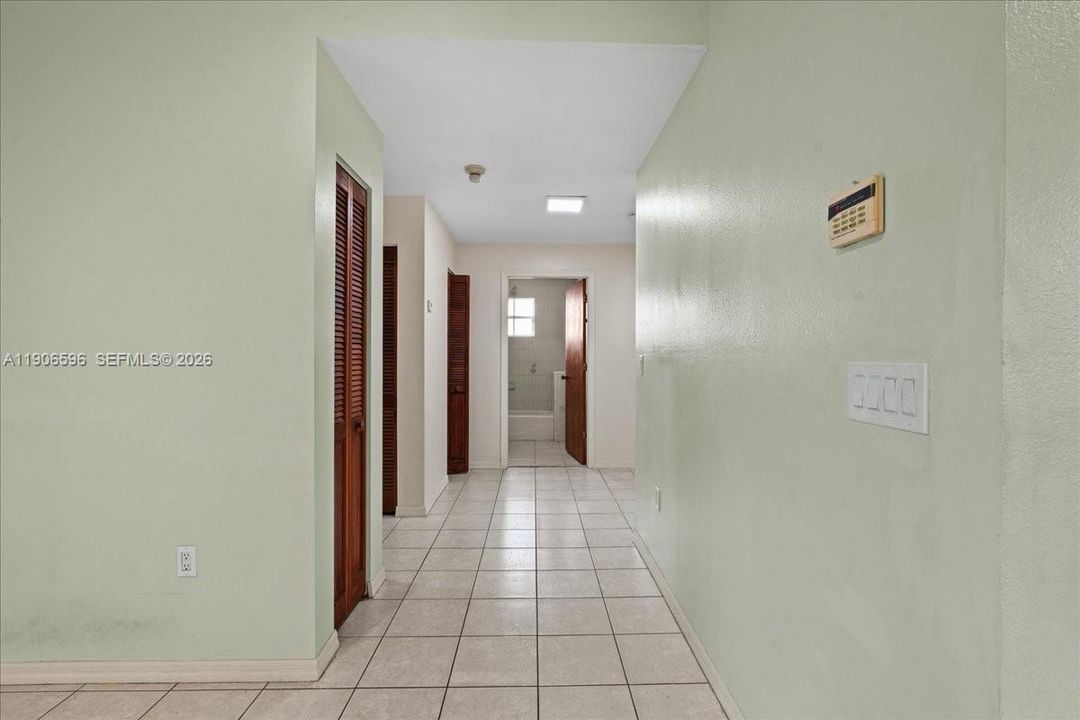 Hallway with storage closets
