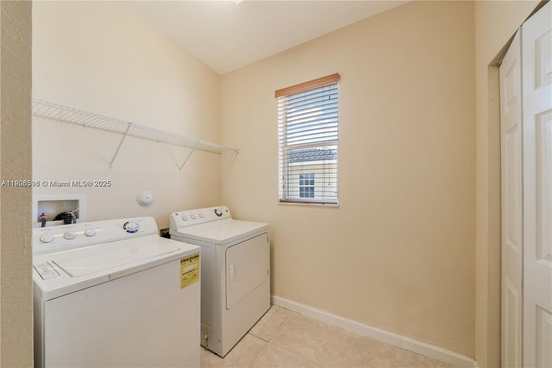 Spacious laundry room with closet