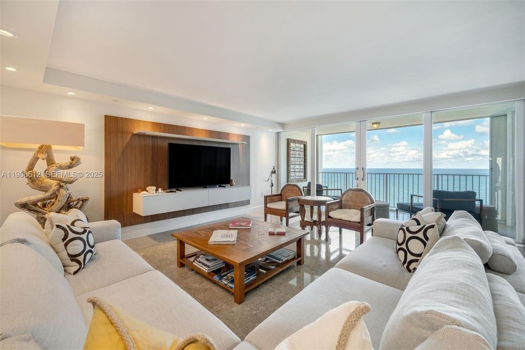 Newly furnished, modern oceanfront living room with stunning views.