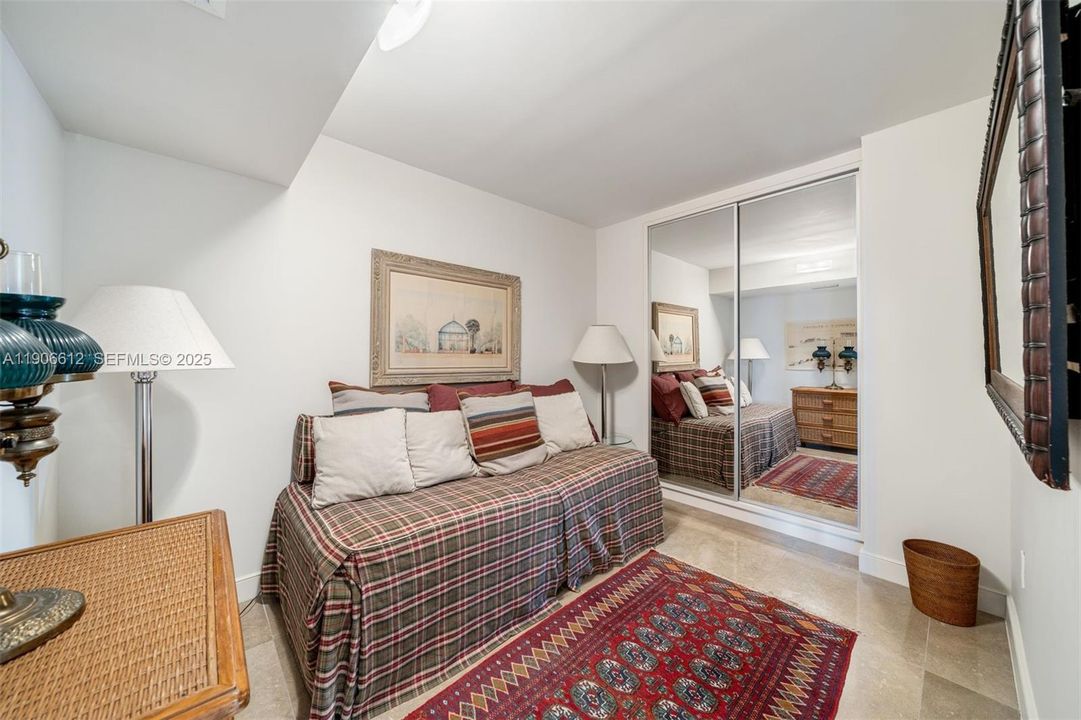 Enclosed den currently set up as a bedroom with twin trundle bed (twin over twin) and closet.