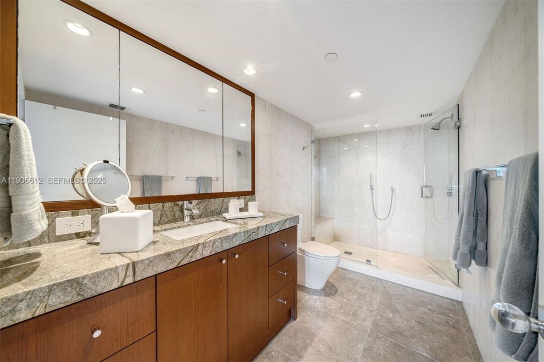 Primary bathroom with walk-in shower.