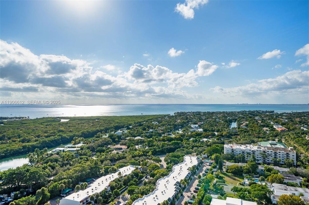 Bedrooms capture gorgeous sunset views over Biscayne Bay and Key Biscayne.