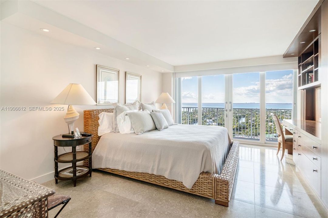 Primary bedroom with king bed and beautiful bay views.