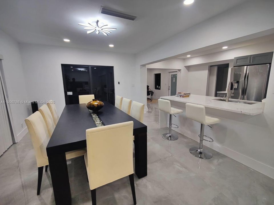 All New Waterfall Quartz & Wood Cabinetry