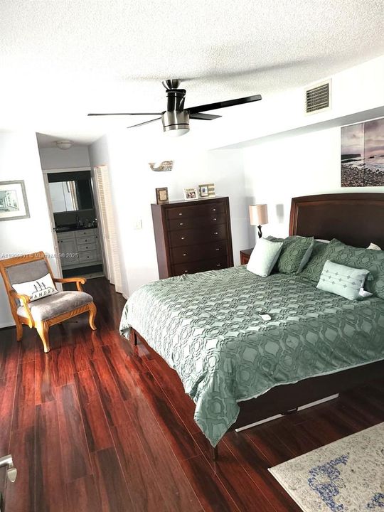 Primary bedroom with balcony