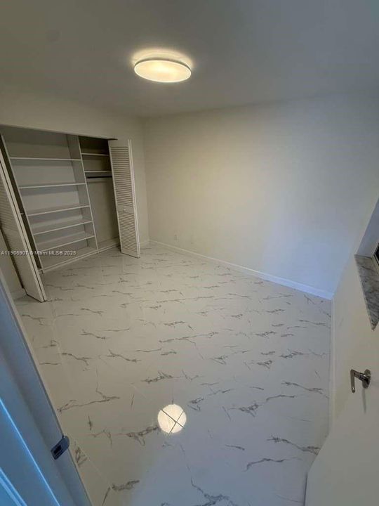 SECOND BEDROOM WITH BUILT OUT CLOSET