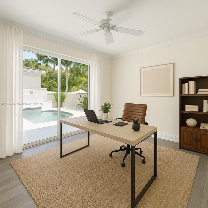 Virtually staged home office off courtyard/pool.