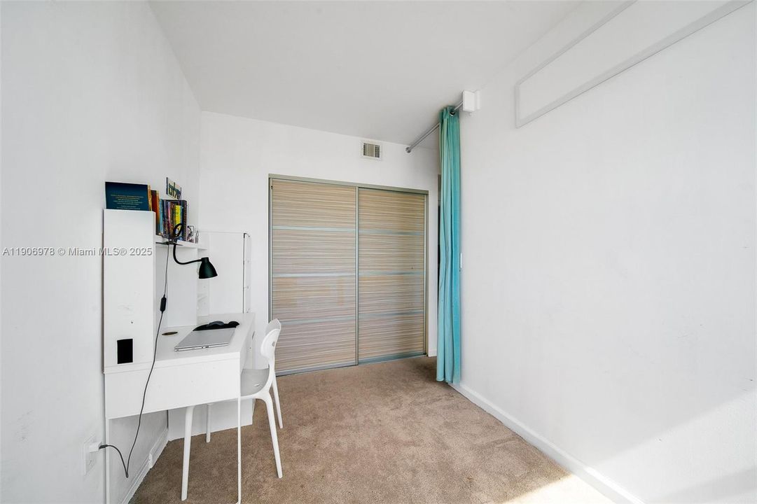 Den is divided in two with drywall, can easily be converted back into living area.