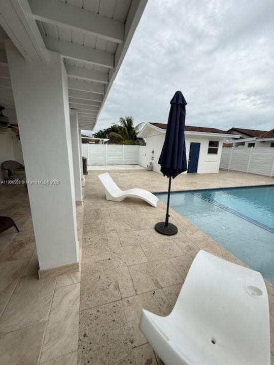 Pool area and view of storage bldg