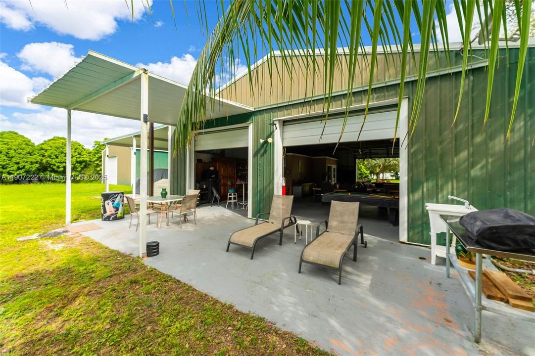 Detached  OUTBUILD ING #1 used as an outdoor living area w/ 1/2 bath & office