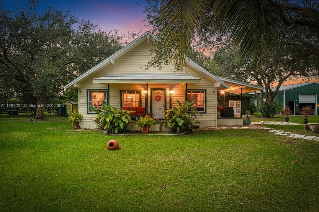 1.54 AC 3/2, 1/1 detached garage used as outdoor living space w/ 1/2 bath & office & ac.