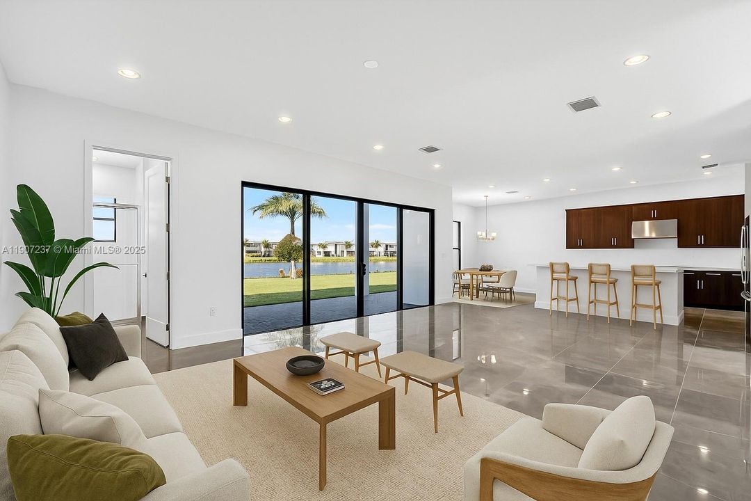 virtual staging living room/tv room overlooking kitchen