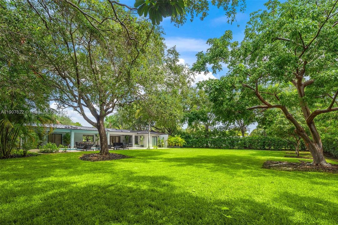Set on an oversized 17,424 sq ft lot, this property offers space, privacy, and freedom — with mature trees, manicured landscaping, and endless room to expand, entertain, or simply enjoy the outdoors.