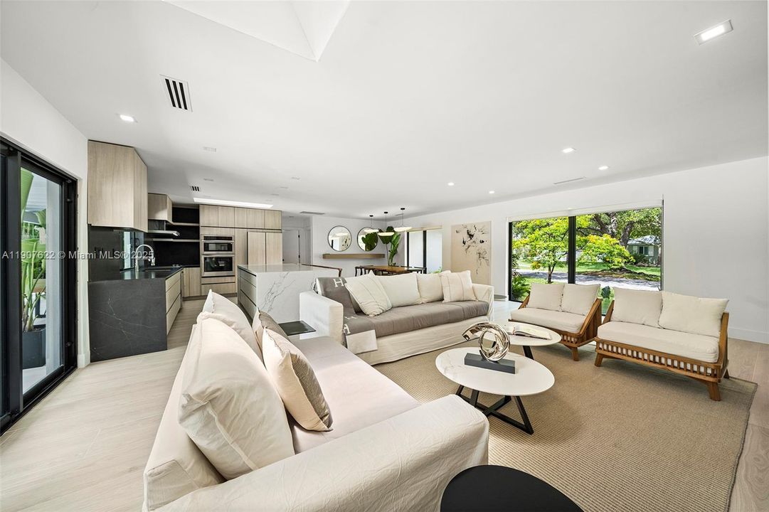 The home’s open-concept design enhances visibility and connection—each space flows effortlessly into the next, with framed garden views anchoring the layout.