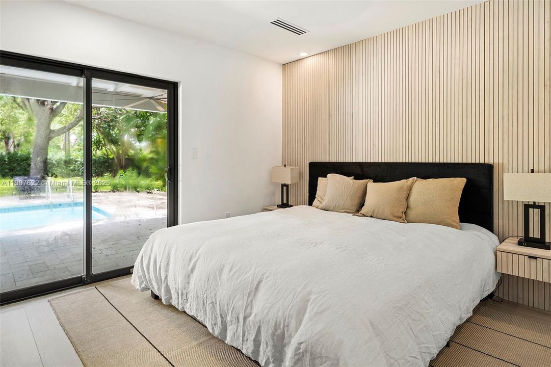 Wake up to garden views and step directly onto the covered terrace—this bedroom blends indoor comfort with outdoor serenity.