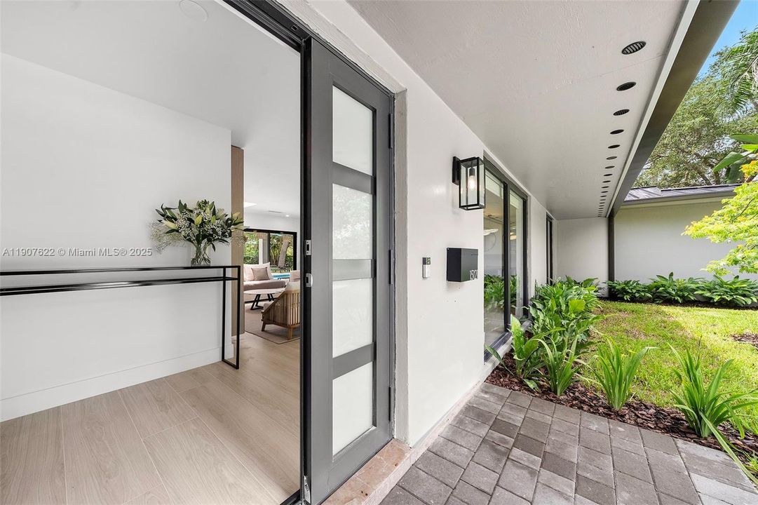 Step into a truly unique home through a wide, elegant entrance that reflects the quality and style found throughout.