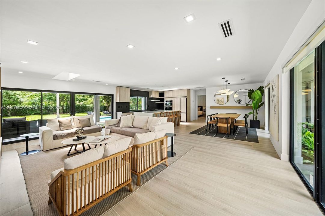 A perfect open-concept layout for family living—kitchen, dining, and living areas seamlessly flow together to create one unified, inviting space.