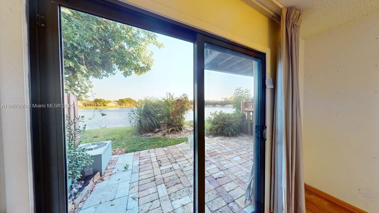 Peaceful garden outlook with a stunning view of the exclusive Indian Lake  perfect for morning coffee, yoga, or simply enjoying nature’s calm right outside your door.