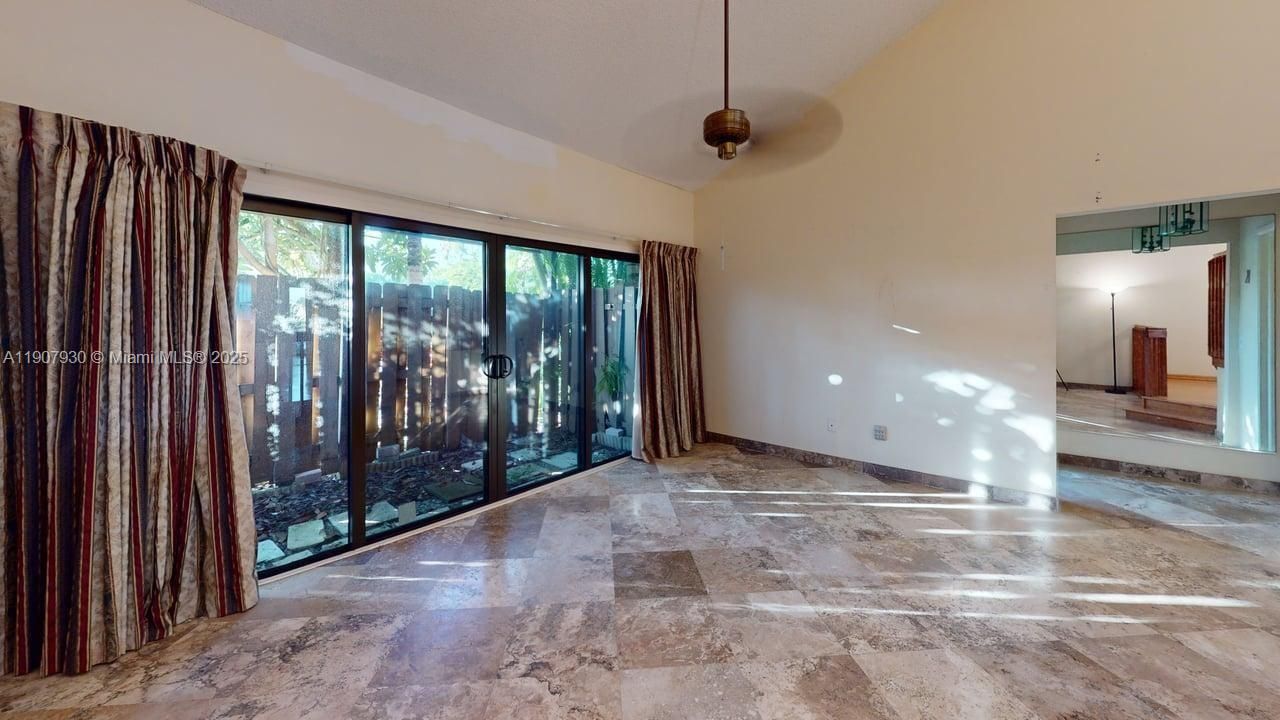 Spacious open living area with high-end polished porcelain floors and stunning natural light that highlights every detail.