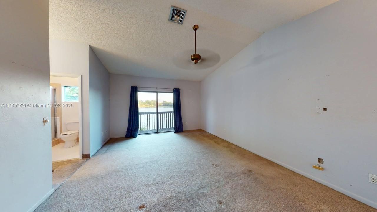 Spacious upstairs bedrooms with large windows and beautiful light throughout the day each offering peaceful comfort and views of lush greenery and Indian Lake.