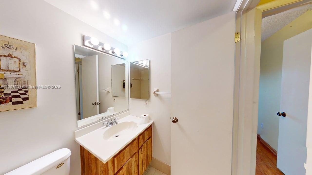 Clean and modern bathroom with natural lighting and classic fixtures that elevate everyday living.