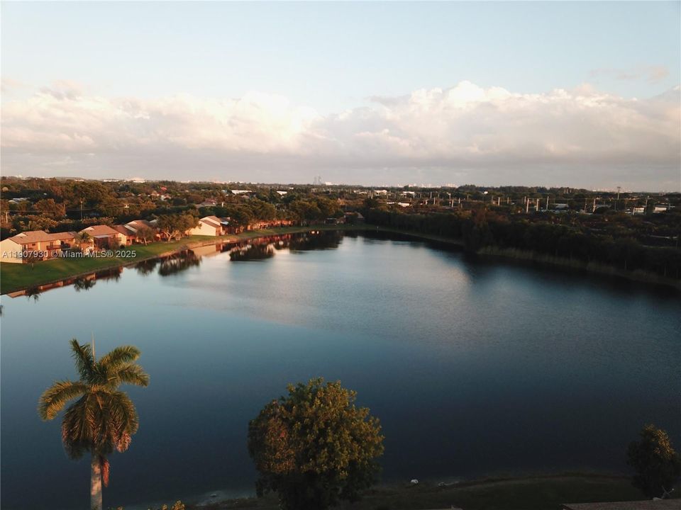 Breathtaking aerial view of Indian lake showcasing the serene water, lush greenery and peaceful neighborhood surroundings.