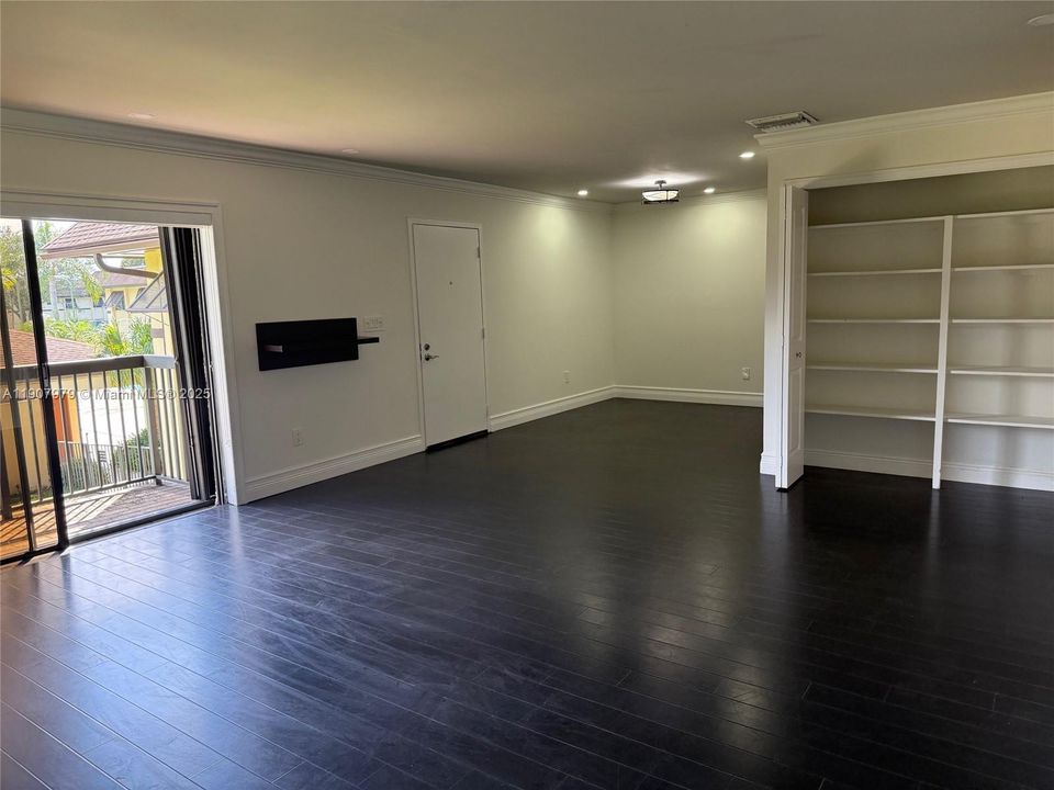 dining/living area with built-in cabinets