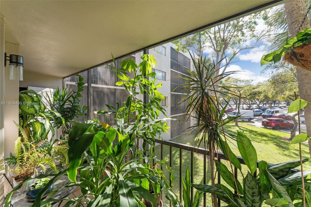 The balcony has two storage units, one on each side.
