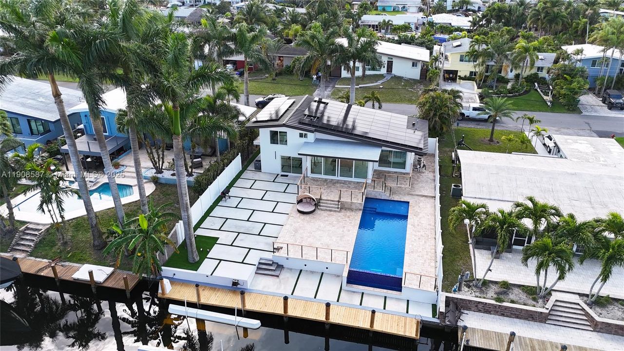 Brand new roof, solar panels, dock, and 550 sq ft, heated, salt water pool.