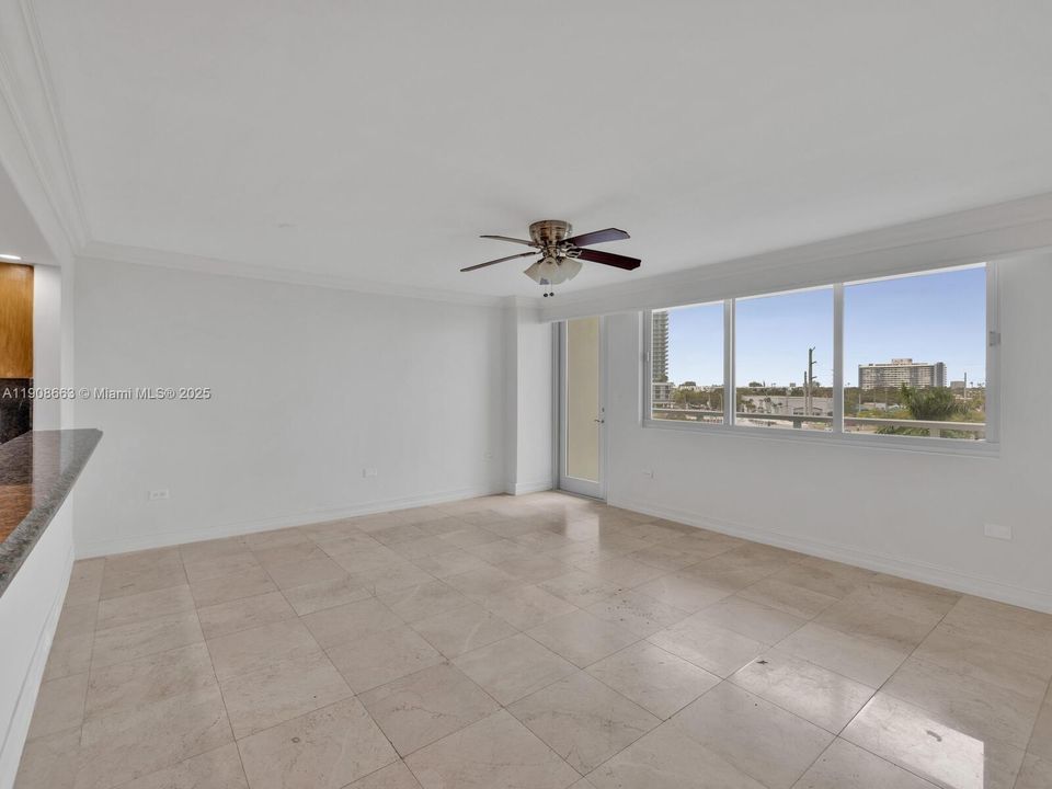 Large Open Living Room with Door to Balcony