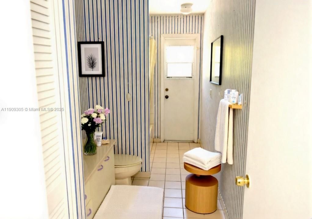 Bathroom with pool/patio access; Virtual Staging