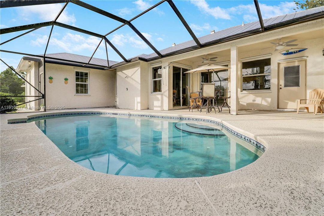 Screen enclosed pool with large patio area