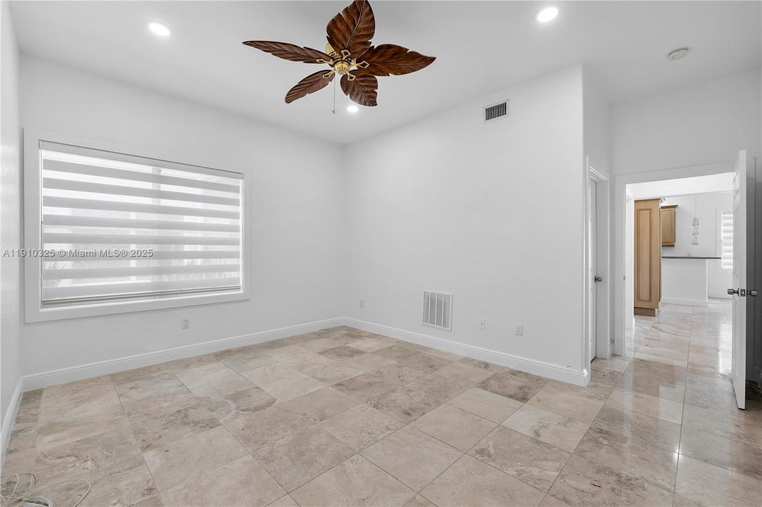 Bedroom #2 w marble flooring and walk in closet en suite bathroom