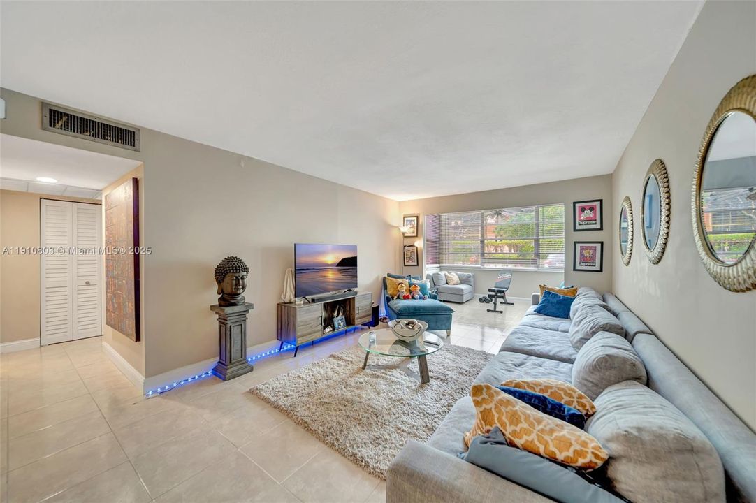 Spacious living room area - On left, hallway to guest bathroom/bedroom. Split Floorplan