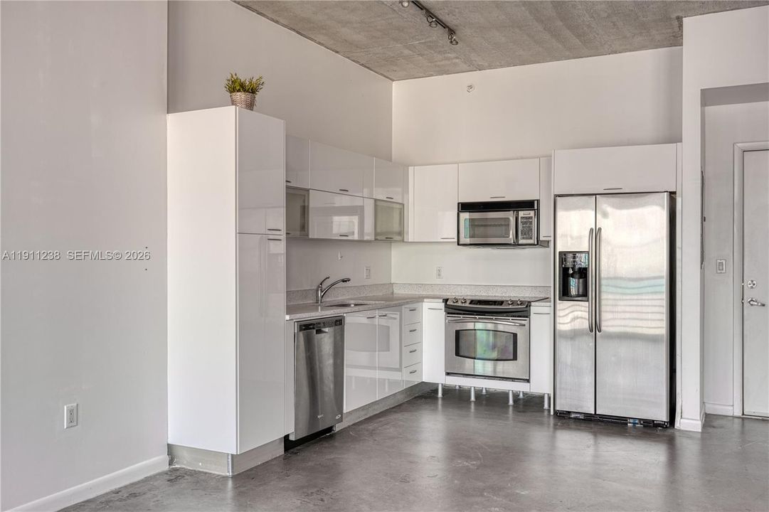 Full kitchen with lots of storage and stainless steel appliances