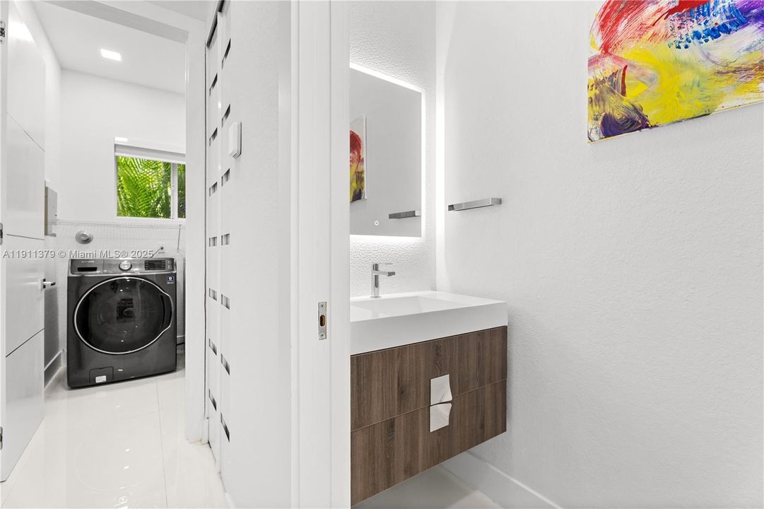 Half bathroom off Fam Rm + a separate laundry room.