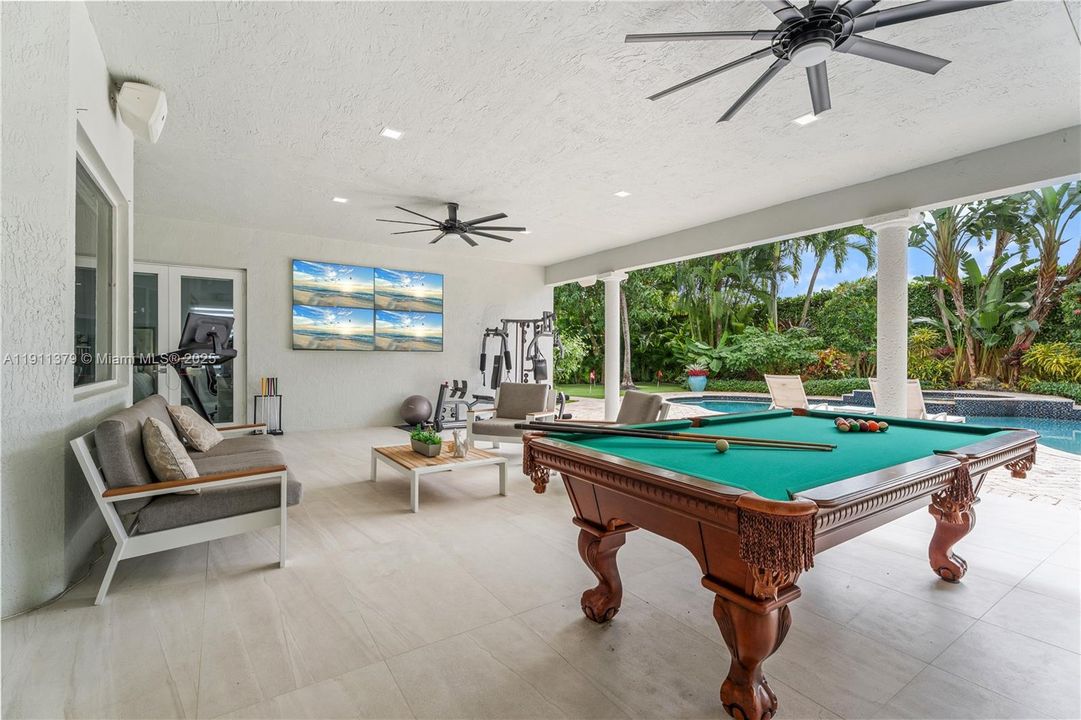 Breezy covered living terrace poolside