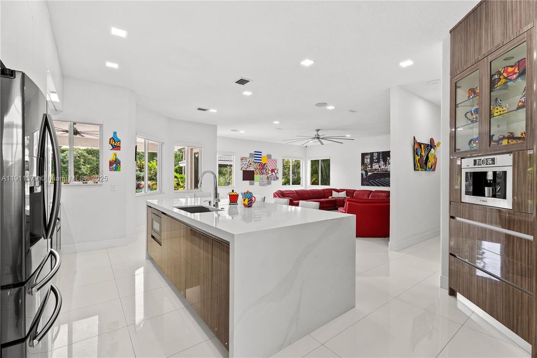 Kitchen family room is large, overlooking pool & gardens