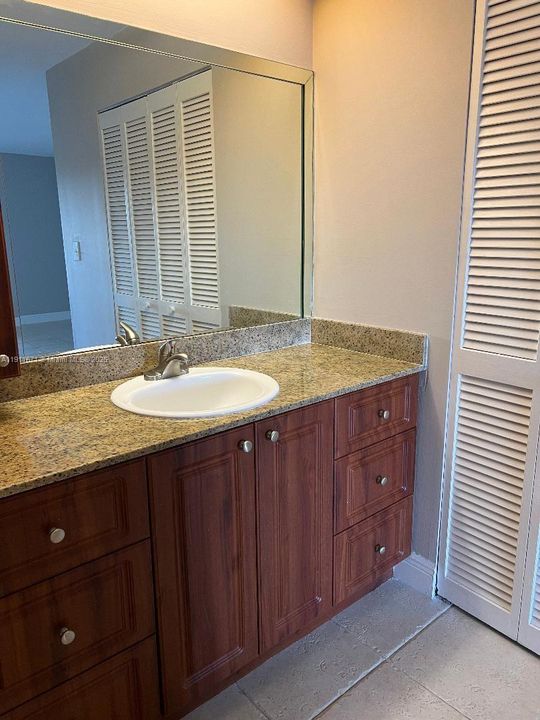 Bathroom #2 with walk in closet next to it.