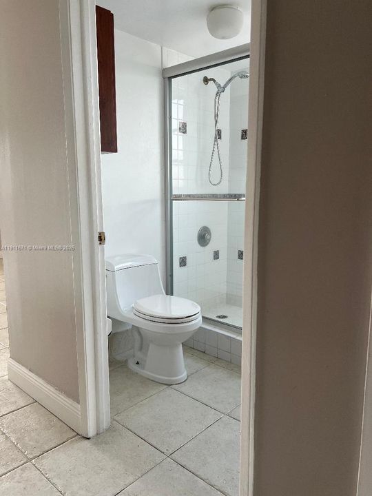 Master bathroom with separate toilet and shower.