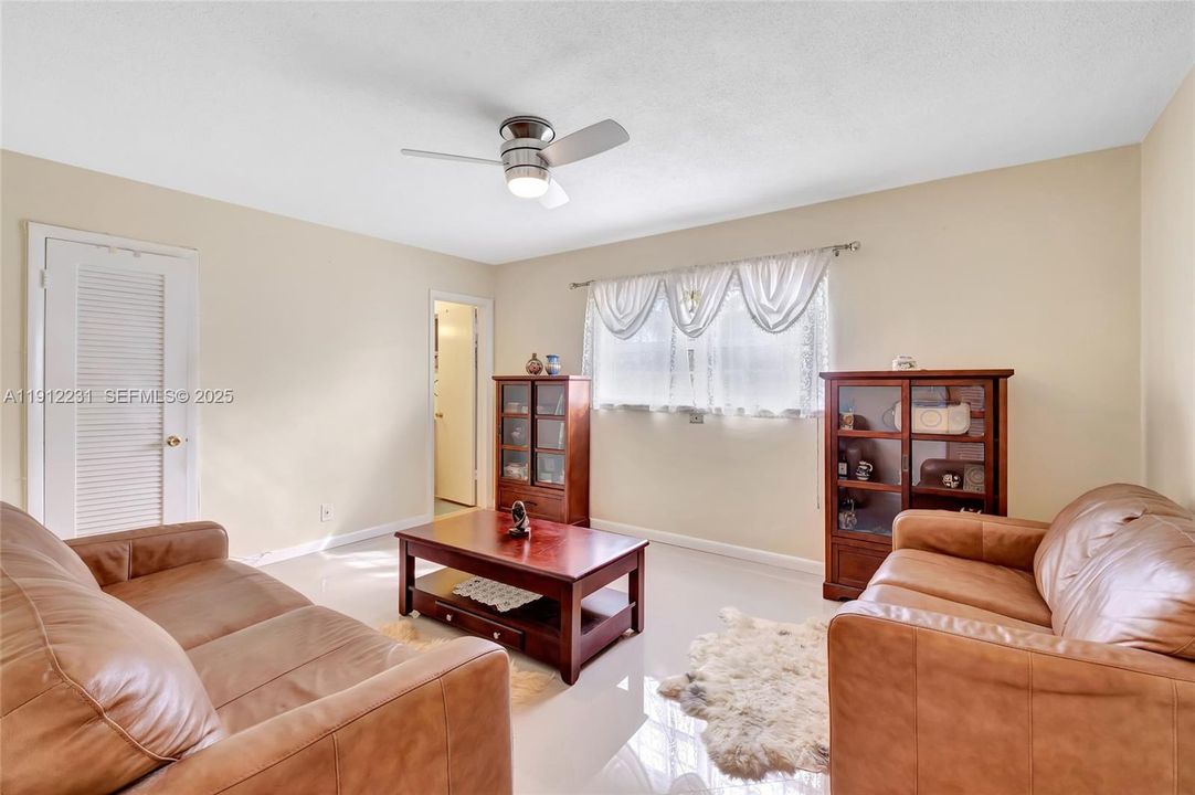 Guest bedroom, with great ambiance, lovely porcelain floors.