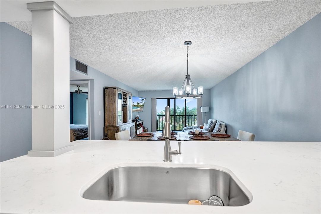 Kitchen opens to a dining and living areas.