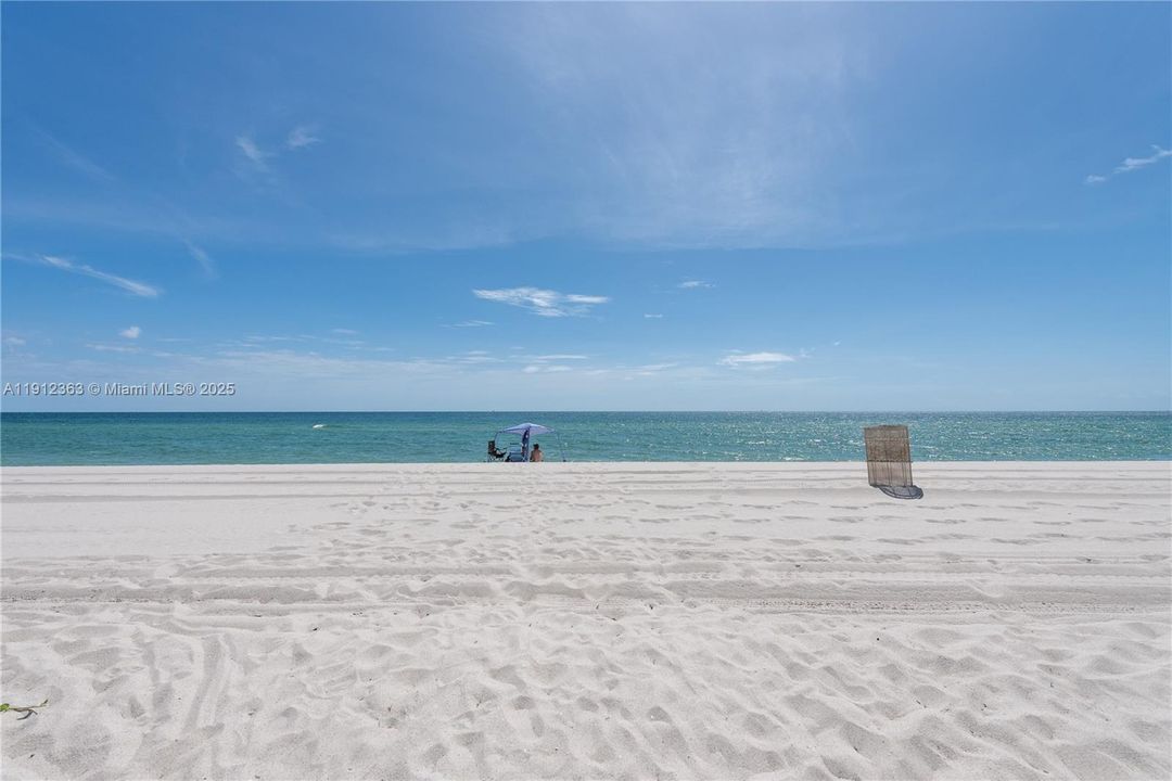 Beach behind condominium.